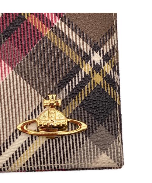 Vivienne Westwood（ヴィヴィアンウエストウッド）Vivienne Westwood (ヴィヴィアンウエストウッド) タータンチェック2つ折り財布 ベージュ×レッドの古着・服飾アイテム