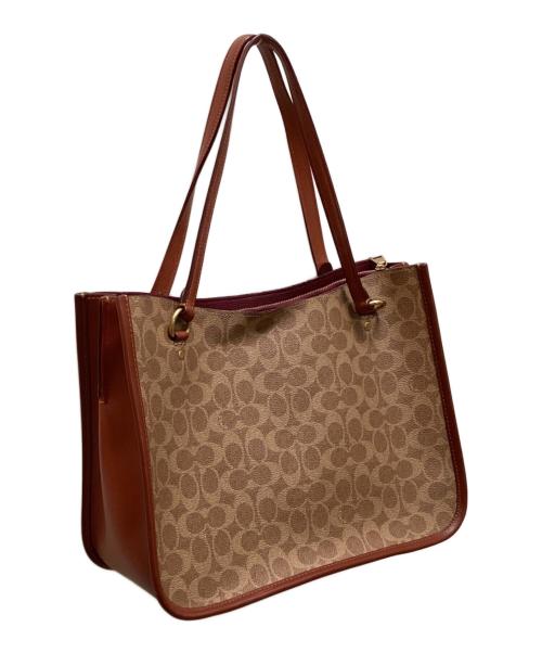 COACH（コーチ）COACH (コーチ) タイラー キャリーオール シグネチャー キャンバス 2WAYバッグ ベージュの古着・服飾アイテム