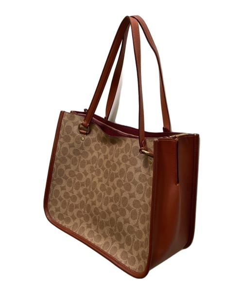 COACH（コーチ）COACH (コーチ) タイラー キャリーオール シグネチャー キャンバス 2WAYバッグ ベージュの古着・服飾アイテム