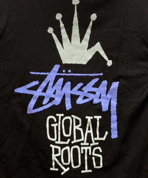 stussy（ステューシー）stussy (ステューシー) グローバルルーツTシャツ ブラック サイズ:Mの古着・服飾アイテム