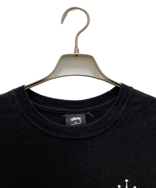 stussy（ステューシー）stussy (ステューシー) グローバルルーツTシャツ ブラック サイズ:Mの古着・服飾アイテム