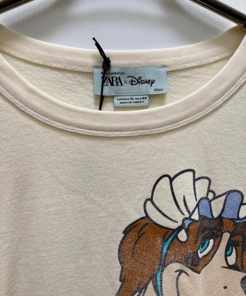 ZARA（ザラ）ZARA (ザラ) Disney (ディズニー) HARRY LAMBERT (ハリー・ランバート) ナナプリントロングスリーブカットソー ベージュ サイズ:XL 未使用品の古着・服飾アイテム