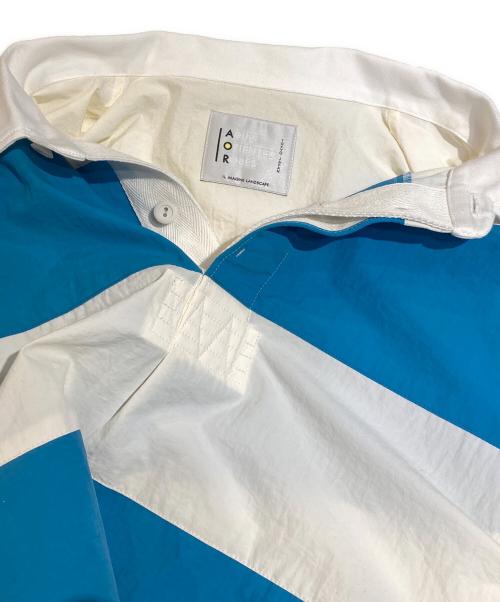 ADULT ORIENTED ROBES（アダルトオリエンテッドローブス）ADULT ORIENTED ROBES (アダルトオリエンテッドローブス) 「Rugby」ナイロンラガーシャツ ブルー サイズ:3の古着・服飾アイテム