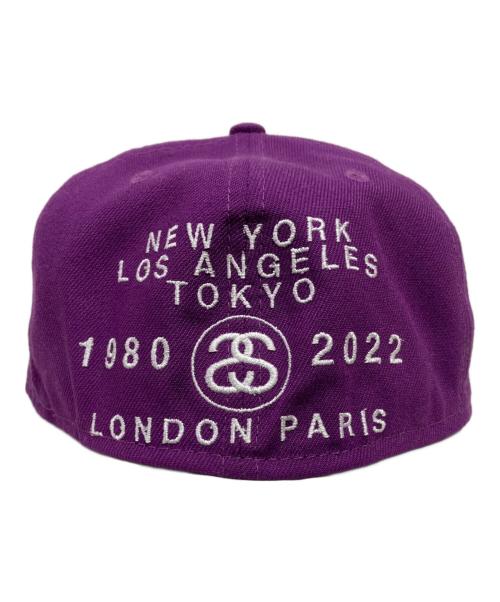 New Era（ニューエラ）New Era (ニューエラ) stussy (ステューシー) Buy Stussy World Tour-キャップ パープル サイズ:7 1/8の古着・服飾アイテム