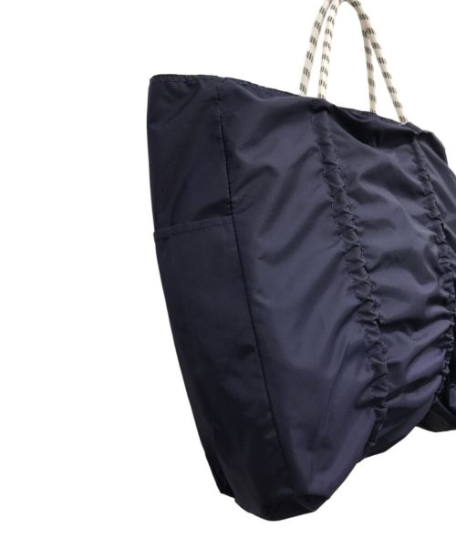 NOMADIS（ノマディス）NOMADIS (ノマディス) リバーシブルロゴトートバッグ アイボリーの古着・服飾アイテム