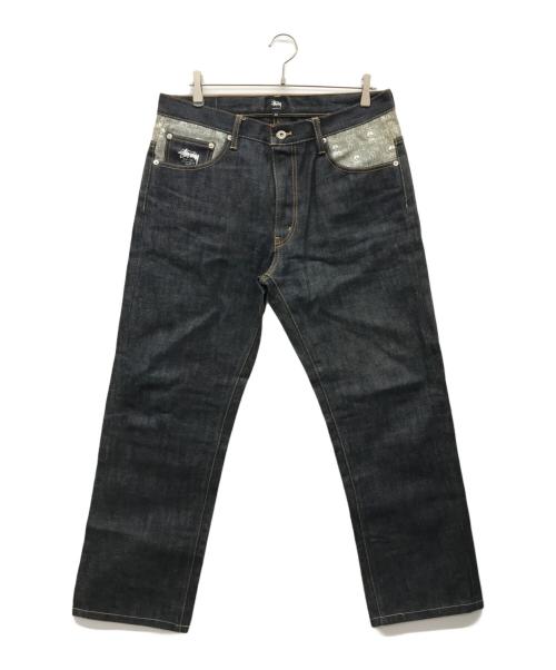 stussy（ステューシー）stussy (ステューシー) スカルプリントデニムパンツ インディゴ サイズ:32の古着・服飾アイテム