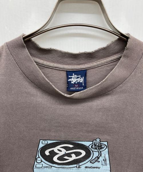 stussy（ステューシー）stussy (ステューシー) SSレコードプレイヤーTee ベージュ サイズ:Mの古着・服飾アイテム