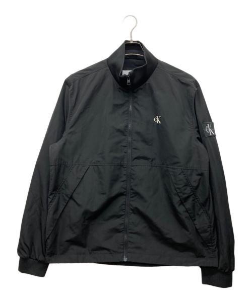 Calvin Klein Jeans（カルバンクラインジーンズ）Calvin Klein Jeans (カルバンクラインジーンズ) ワッペンナイロンジャケット ブラック サイズ:XLの古着・服飾アイテム