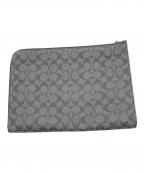 COACHコーチ）の古着「シグネチャークラッチバッグ」｜ブラック