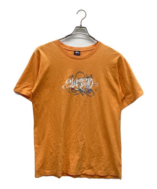 stussy（ステューシー）stussy (ステューシー) プリントTシャツ オレンジ サイズ:Lの古着・服飾アイテム