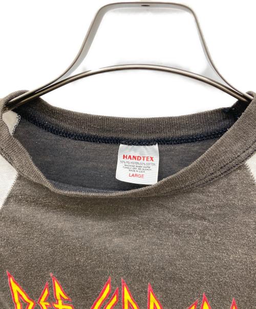 HANDTEX（ハンドテックス）HANDTEX (ハンドテックス) 80sラグランバンドTシャツ DEF LEPPARD HYSTERIA ホワイト×ブラック サイズ:LARGEの古着・服飾アイテム