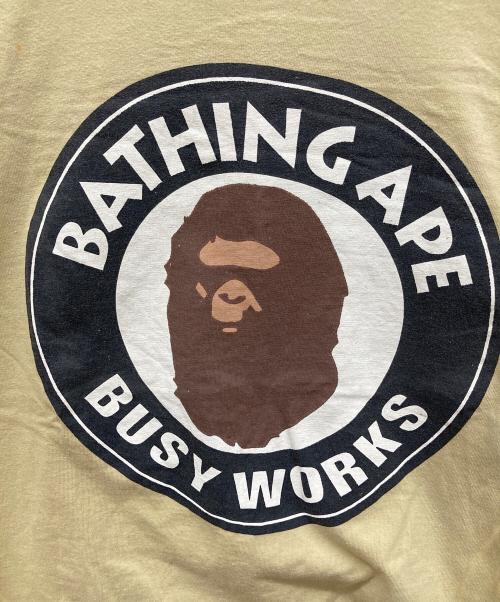 A BATHING APE（アベイシングエイプ）A BATHING APE (アベイシングエイプ) プリントTシャツ ベージュ サイズ:Lの古着・服飾アイテム