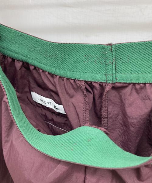 LACOSTE（ラコステ）LACOSTE (ラコステ) リサイクルポリエステルトラックパンツ バーガンディー サイズ:36の古着・服飾アイテム