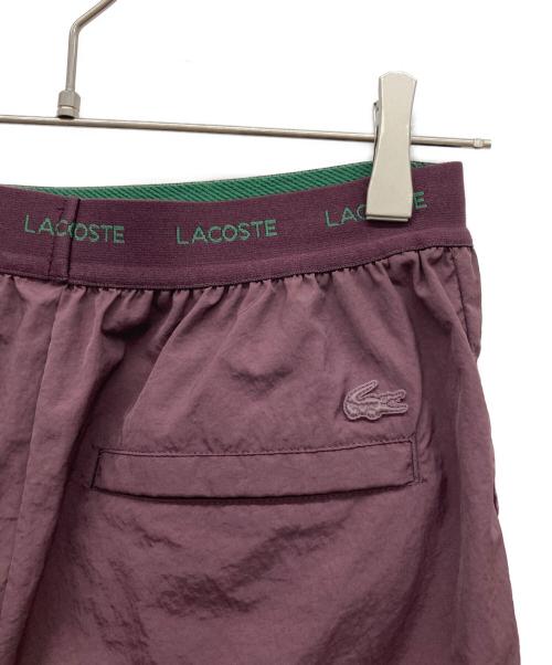 LACOSTE（ラコステ）LACOSTE (ラコステ) リサイクルポリエステルトラックパンツ バーガンディー サイズ:36の古着・服飾アイテム