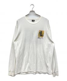 stussy（ステューシー）の古着「モアイプリント長袖カットソー」｜ホワイト