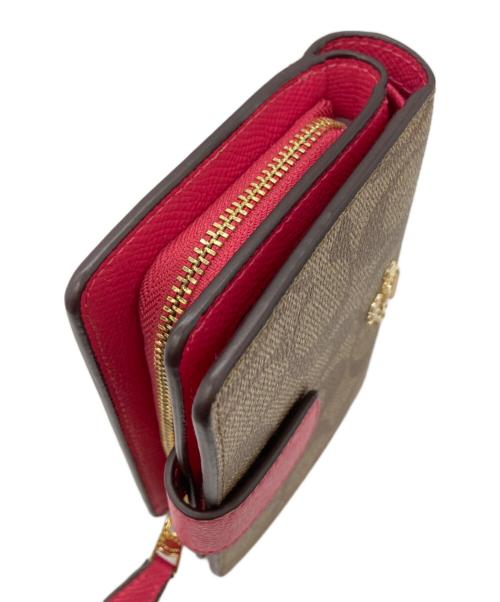 COACH（コーチ）COACH (コーチ) シグネチャー2つ折り財布 ベージュの古着・服飾アイテム