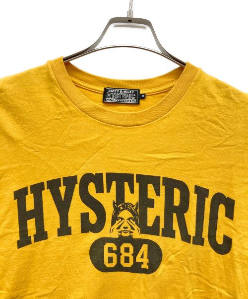 Hysteric Glamour（ヒステリックグラマー）Hysteric Glamour (ヒステリックグラマー) EVIL COLLEGE Tシャツ イエロー サイズ:Mの古着・服飾アイテム