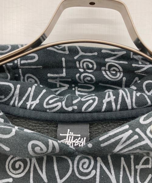 stussy（ステューシー）stussy (ステューシー) ショーンフォント総柄ロゴパーカー ブラック サイズ:MEDIUMの古着・服飾アイテム