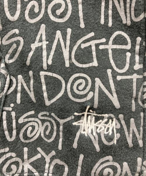 stussy（ステューシー）stussy (ステューシー) ショーンフォント総柄ロゴパーカー ブラック サイズ:MEDIUMの古着・服飾アイテム