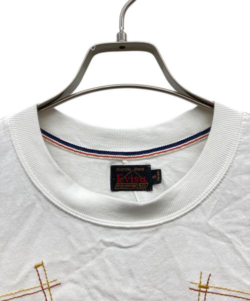 EVISU（エヴィス）EVISU (エヴィス) マルチポケットとマルチプリント リラックスフィットTシャツ ホワイト サイズ:Ｓ 170/100Cの古着・服飾アイテム