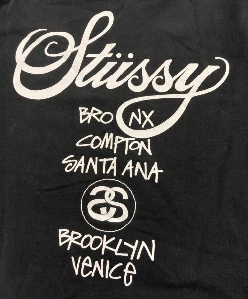 stussy（ステューシー）stussy (ステューシー) ワールドツアー プリントスウェット ブラック サイズ:Mの古着・服飾アイテム