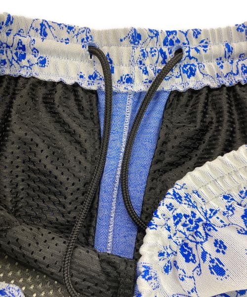 Needles（ニードルズ）Needles (ニードルズ) STUDIOUS (ステュディオス) 別注総柄トラックパンツ スカイブルー サイズ:Mの古着・服飾アイテム