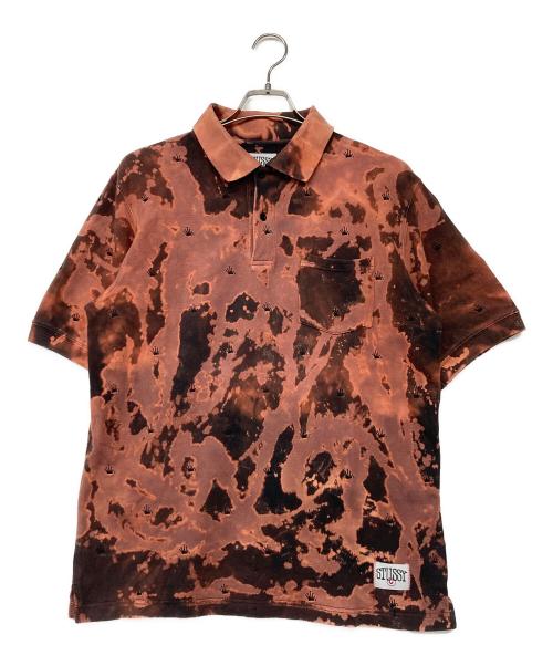 stussy（ステューシー）stussy (ステューシー) ブリーチデザインポロシャツ オレンジ サイズ:MEDIUMの古着・服飾アイテム
