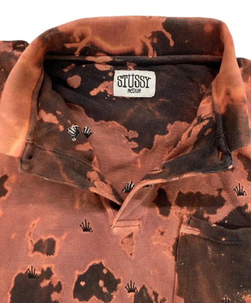 stussy（ステューシー）stussy (ステューシー) ブリーチデザインポロシャツ オレンジ サイズ:MEDIUMの古着・服飾アイテム