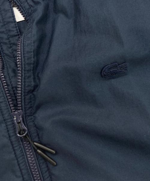 LACOSTE（ラコステ）LACOSTE (ラコステ) 防風・撥水タンカースジャケット ネイビー サイズ:US Sの古着・服飾アイテム