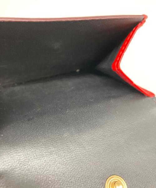 ALEXANDER McQUEEN（アレキサンダーマックイーン）ALEXANDER McQUEEN (アレキサンダーマックイーン) スカル3つ折り財布 レッドの古着・服飾アイテム