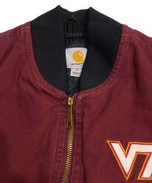 CarHartt（カーハート）CarHartt (カーハート) NCAAロゴ刺繍ダックベスト ボルドー サイズ:Mの古着・服飾アイテム