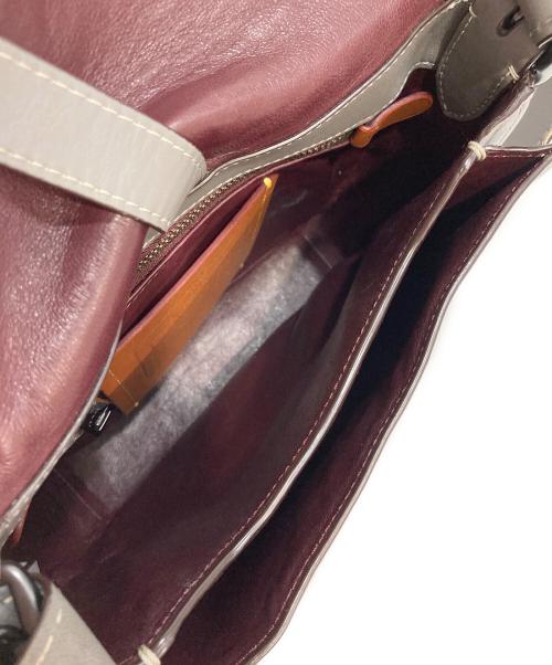 COACH（コーチ）COACH (コーチ) スタッズサドルバッグ グレーの古着・服飾アイテム