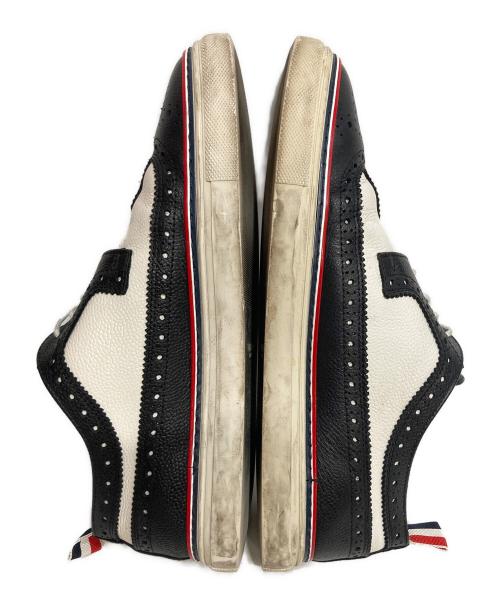 Thom Browne（トムブラウン）Thom Browne (トムブラウン) ウィングチップスニーカー ブラック×ホワイト サイズ:US9の古着・服飾アイテム