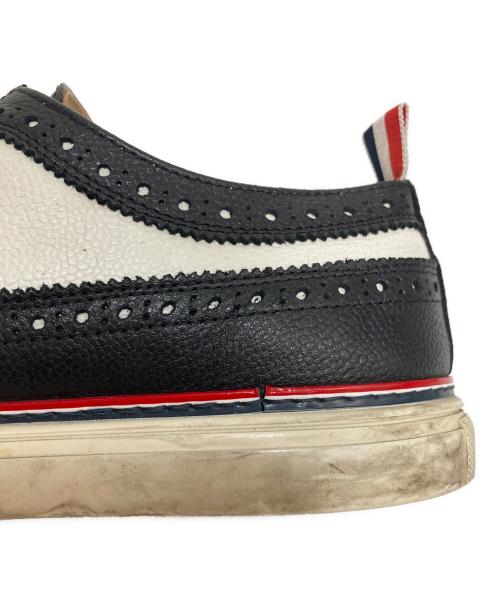 Thom Browne（トムブラウン）Thom Browne (トムブラウン) ウィングチップスニーカー ブラック×ホワイト サイズ:US9の古着・服飾アイテム