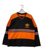 adidasアディダス）の古着「Vネックカットソー」｜オレンジ×ブラック