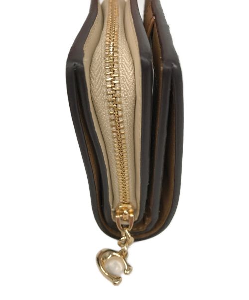 COACH（コーチ）COACH (コーチ) シグネチャー モノグラム プリント スナップ ウォレット ベージュの古着・服飾アイテム