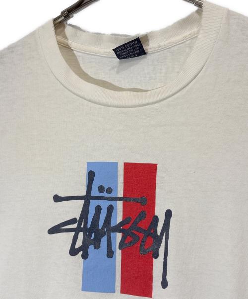 stussy（ステューシー）stussy (ステューシー) ボロプリントTシャツ ホワイト サイズ:Lの古着・服飾アイテム