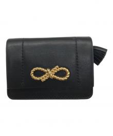 ANYA HINDMARCH（アニヤ・ハインドマーチ）の古着「ツイストリボンデザイン 三つ折財布」｜ブラック