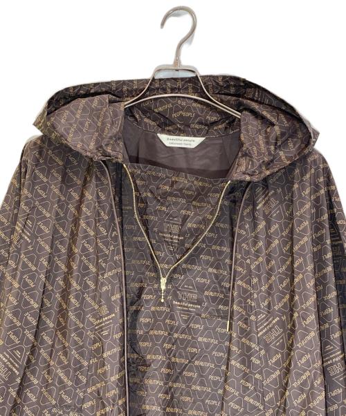 beautiful people（ビューティフルピープル）beautiful people (ビューティフルピープル) 総ロゴプリントレインポンチョ ブラウン サイズ:36の古着・服飾アイテム