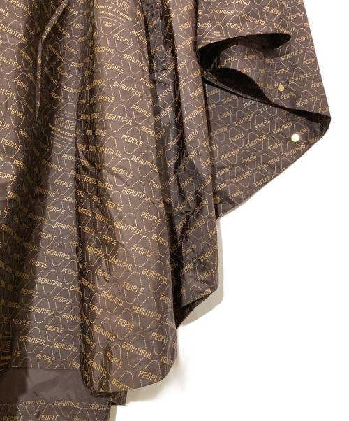 beautiful people（ビューティフルピープル）beautiful people (ビューティフルピープル) 総ロゴプリントレインポンチョ ブラウン サイズ:36の古着・服飾アイテム