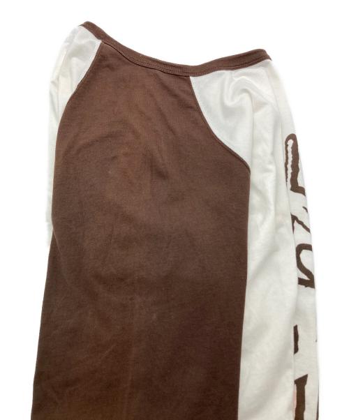 stussy（ステューシー）stussy (ステューシー) プリントロゴバイカラーラグランT ホワイト×ブラウン サイズ:Mの古着・服飾アイテム