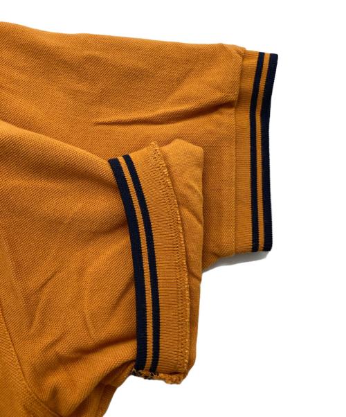 FRED PERRY（フレッドペリー）FRED PERRY (フレッドペリー) ポロシャツ オレンジ サイズ:Sの古着・服飾アイテム