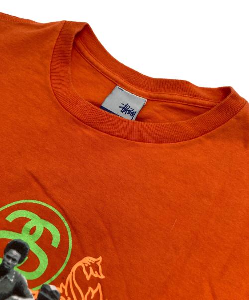 stussy（ステューシー）stussy (ステューシー) プリントTシャツ オレンジ サイズ:Sの古着・服飾アイテム