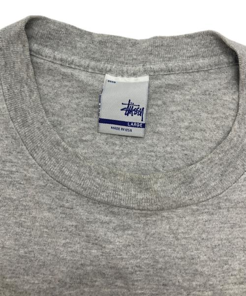 stussy（ステューシー）stussy (ステューシー) メタリックロゴtシャツ グレー サイズ:Lの古着・服飾アイテム
