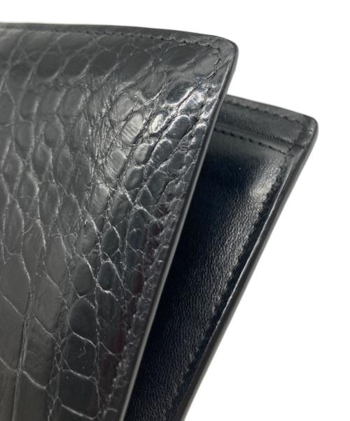 BOTTEGA VENETA（ボッテガベネタ）BOTTEGA VENETA (ボッテガベネタ) 型押し二つ折り財布 ブラックの古着・服飾アイテム