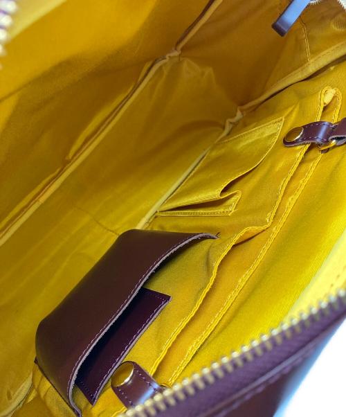 FELISSIMO（フェリシモ）FELISSIMO (フェリシモ) ファッションスタイリストと作った 職人本革のエチューデントバッグ バーガンディーの古着・服飾アイテム