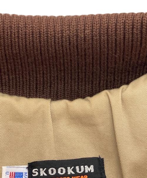 skookum（スクーカム）skookum (スクーカム) NEPENTHES (ネペンテス) レザーアームスタジャン カーキ×ブラウン サイズ:38の古着・服飾アイテム