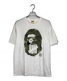 A BATHING APE×UNDEFEATED（アベイシングエイプ×アンディフィーテッド）の古着「プリントTシャツ」｜ホワイト