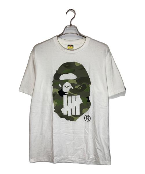 A BATHING APE（アベイシングエイプ）A BATHING APE (アベイシングエイプ) UNDEFEATED (アンディフィーテッド) プリントTシャツ ホワイト サイズ:XLの古着・服飾アイテム