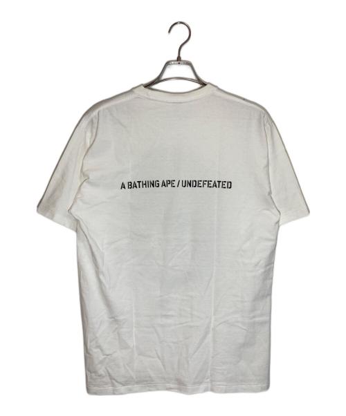 A BATHING APE（アベイシングエイプ）A BATHING APE (アベイシングエイプ) UNDEFEATED (アンディフィーテッド) プリントTシャツ ホワイト サイズ:XLの古着・服飾アイテム
